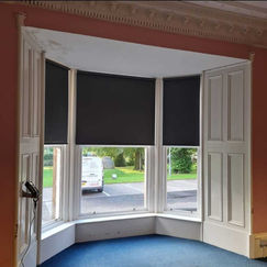 grey blinds in bay window 