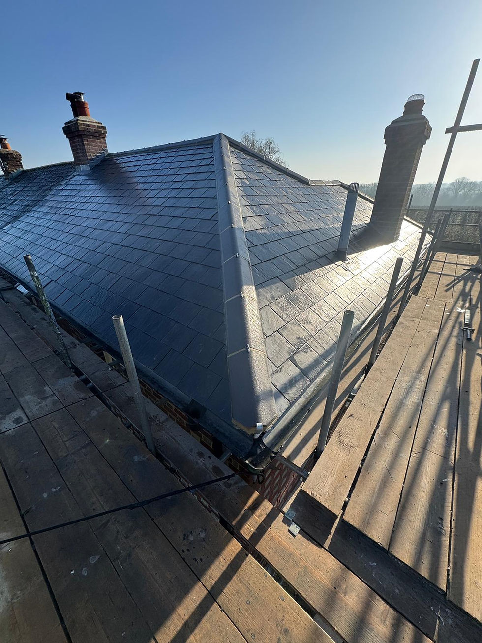 New slate roof installation with scaffolding