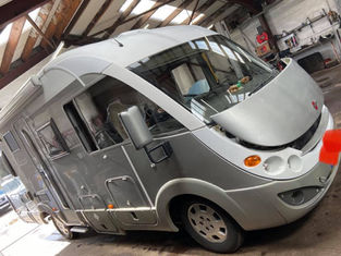 Silver motorhome in garage