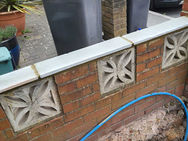 Brick garden wall with decorative finish and quality detail