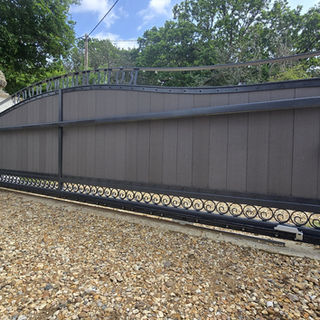 Black composite and metal driveway gate 