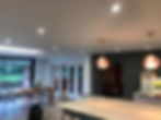 Kitchen with hanging lights over island