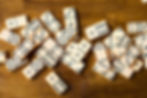 Dominoes laid out on wooden table
