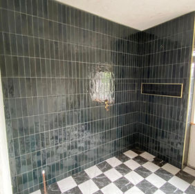 Black subway tiles in bathroom