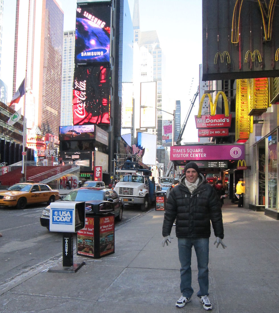 Times Square in New York City during our family trip, showing the bright lights and iconic streets of Midtown Manhattan.