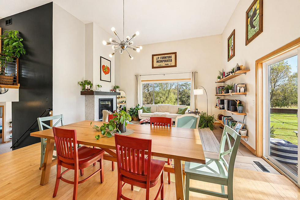 open concept dining and living space in custom home Minnesota with natural light, fireplace, and modern design