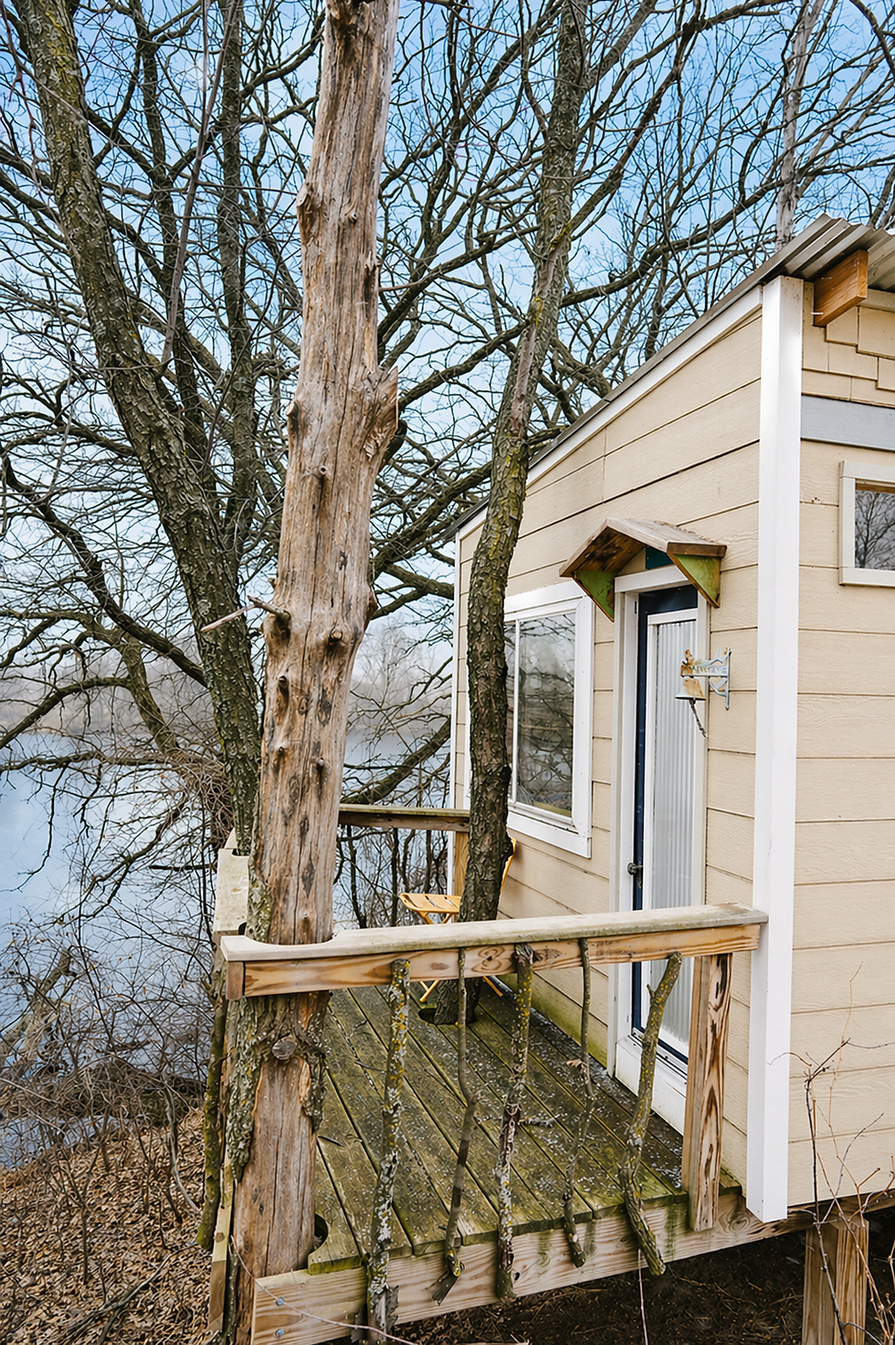 treehouse deck tucked into the trees with lake views and private outdoor access