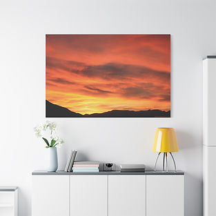 Wall canvas reproduction of real sunset wall art showing orange tones above sharp silhouettes - ideal for tranquil and stylish hotel settings.