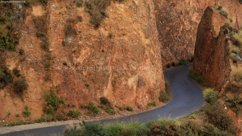 Centre-cropped full-width 16:9 landscape photograph of GR-4202 mountain track east of Tijola, Las Alpujarras - straight photography with no digital enhancement, ideal for hotel decor.