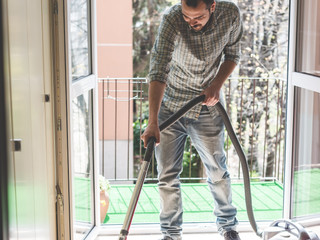 graphicstock-handsome-stylish-man-using-hoover-at-home_rTeuJhpiyb.jpg