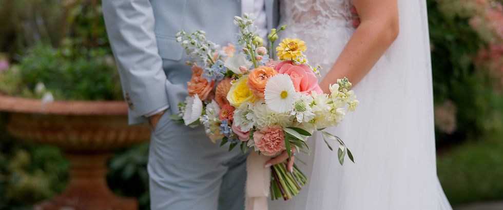 bride with groom holding flowers