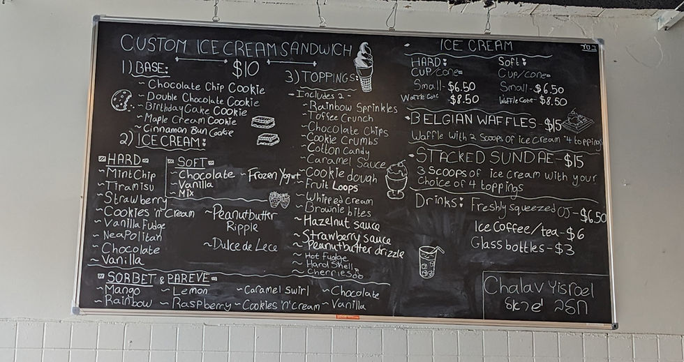 Chalkboard menu with custom ice cream sandwich options, flavors, and prices listed. Includes Belgian waffles, sundaes, and drinks.