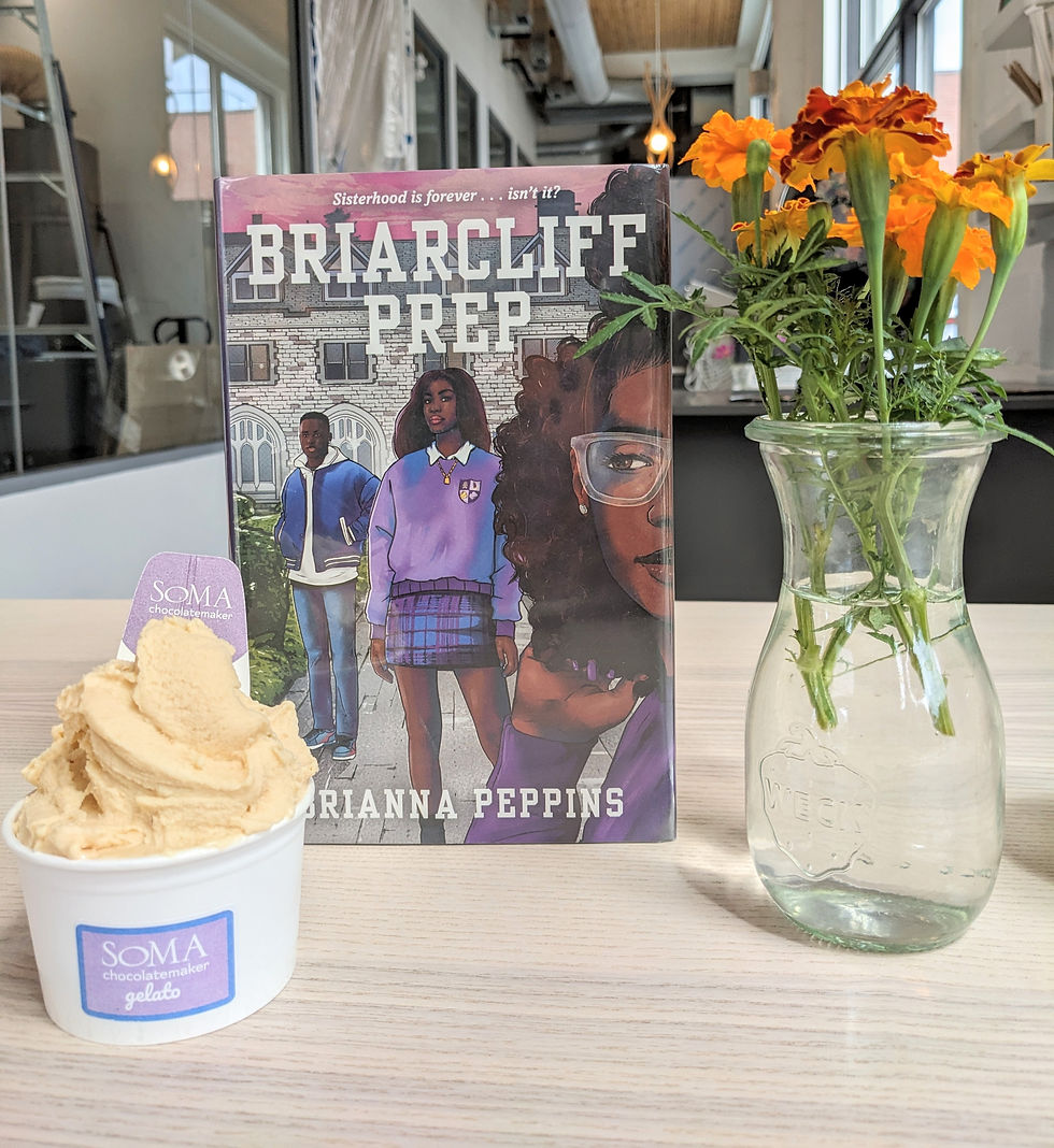book with ice cream and flowers next to it