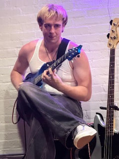 Ryan seated playing .jpeg