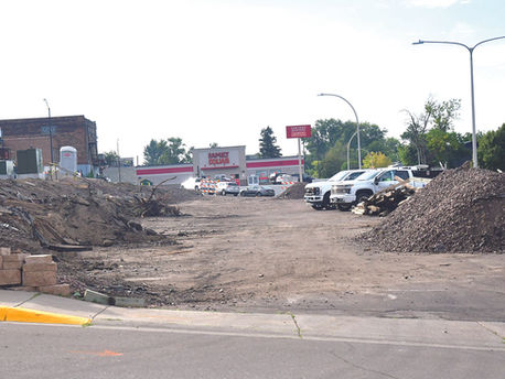 THE LOWER PARKING LOT across from Hartman’s Super Valu will be getting a facelift this fall. Crews will be repairing the retaining wall and redoing the paving in the parking lot.