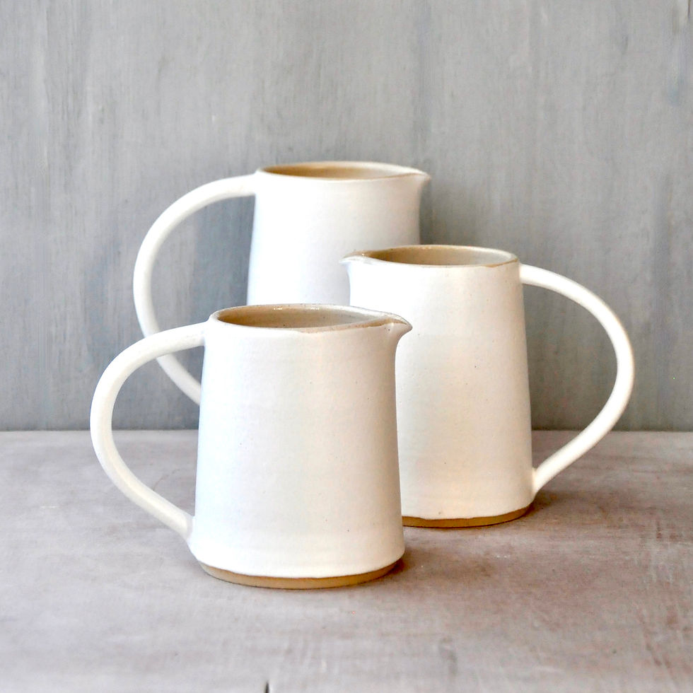 Thumbnail: White stoneware jugs finished in Fat White glaze