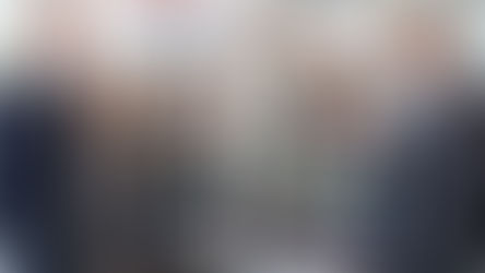 Business people smiling considering IPO listing pathway