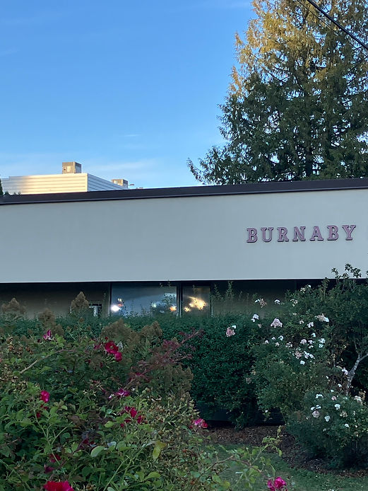 Burnaby sign on a building next to the sidewalk.jpg