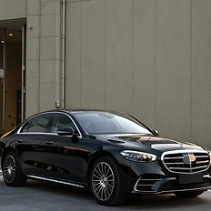 Black luxury sedan for executive transportation and private chauffeur service.