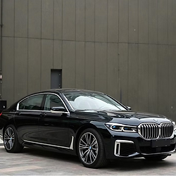 Black luxury sedan for executive transportation and private chauffeur service.