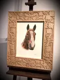 A head and chest horse portrait in a beautiful wooden frame.