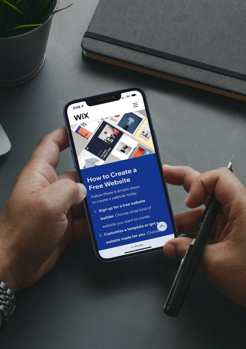 phone user looks at how to create a free Wix website