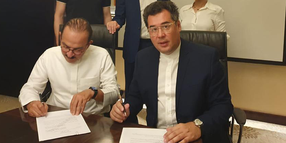 Pavel Rudanovskiy celebrating the milestone of attracting over 1 billion dollars in investments to the UAE market, exemplifying his financial acumen.