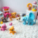 white shag carpet surrounded by littlest pet shop toys.jpg