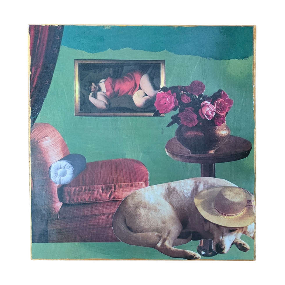 "Mixed media collage on wood board by Joan Ellis titled Harmonious. Features a sleeping dog wearing a straw hat, a vase of re