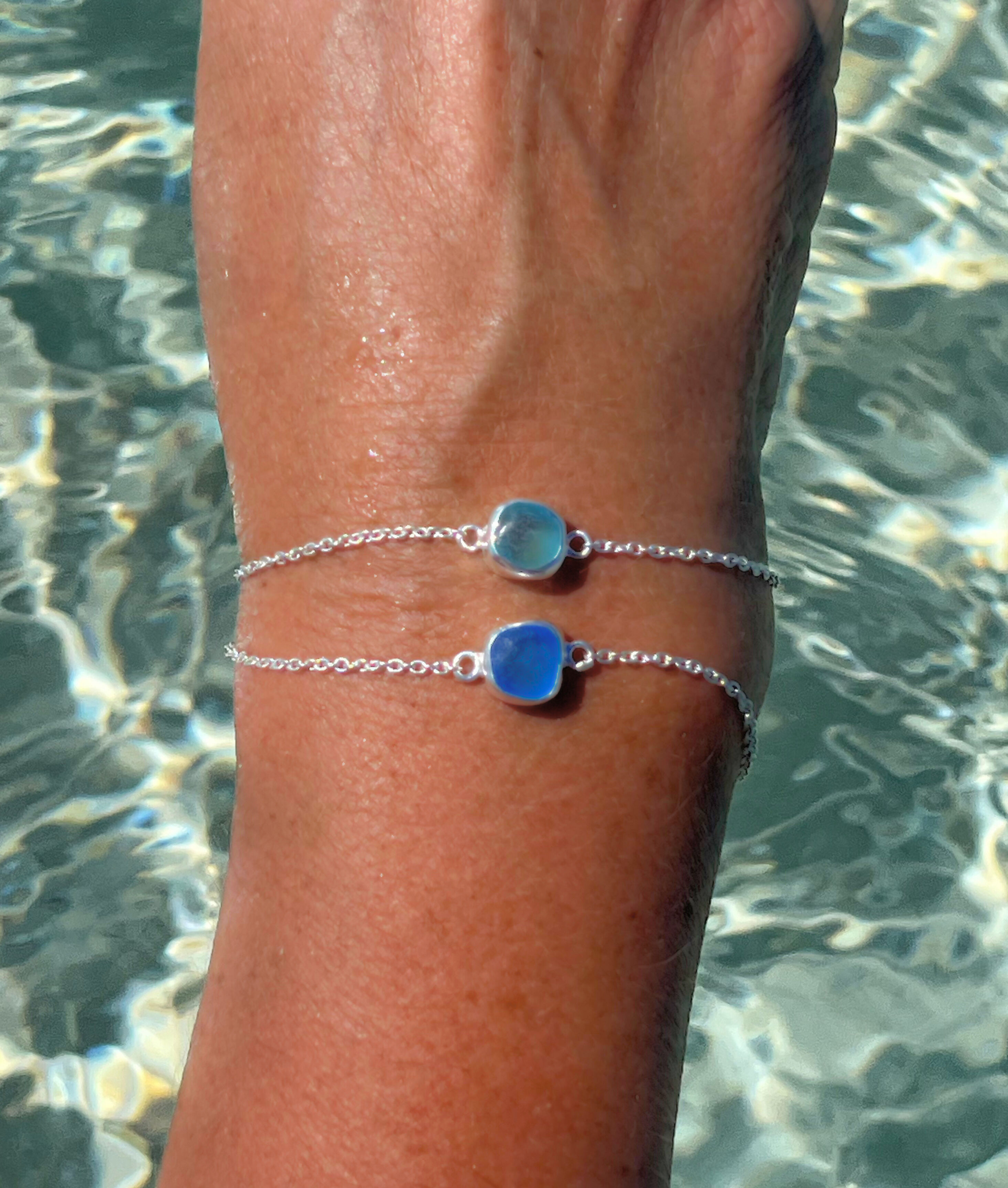 dainty sea glass bracelet on hand