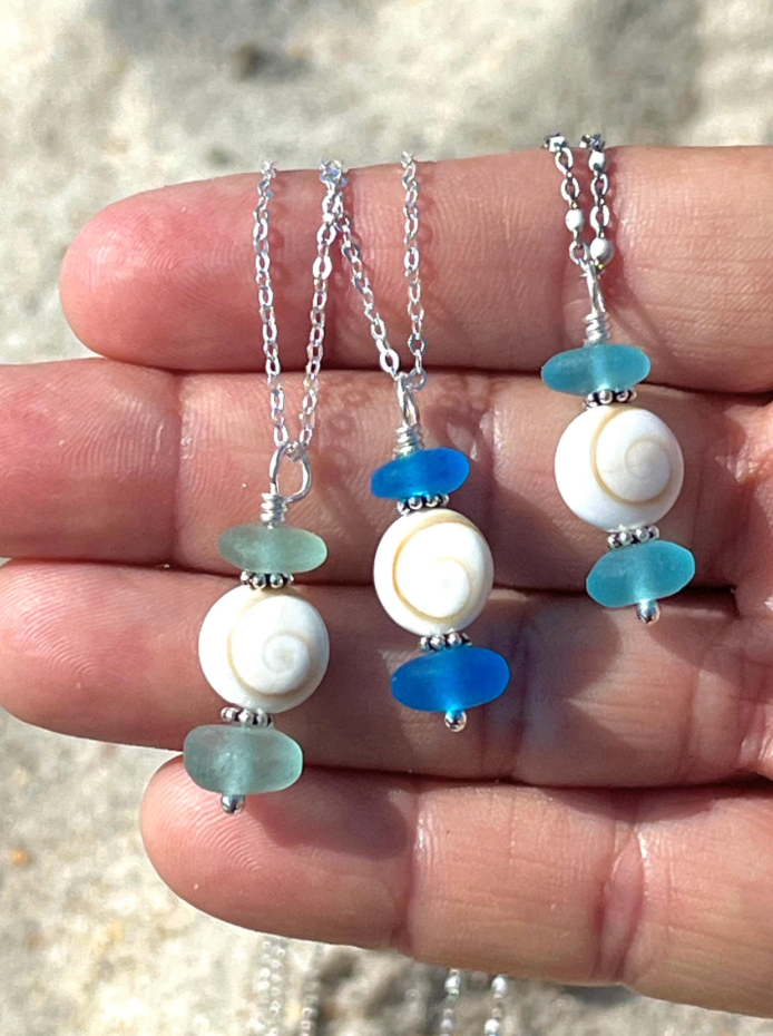 Thumbnail: shell and sea glass necklaces on hand
