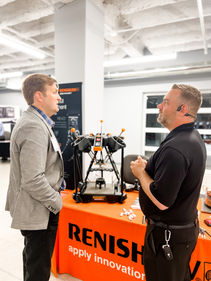 Jeff Higginbotham (R) at the Renishaw booth.