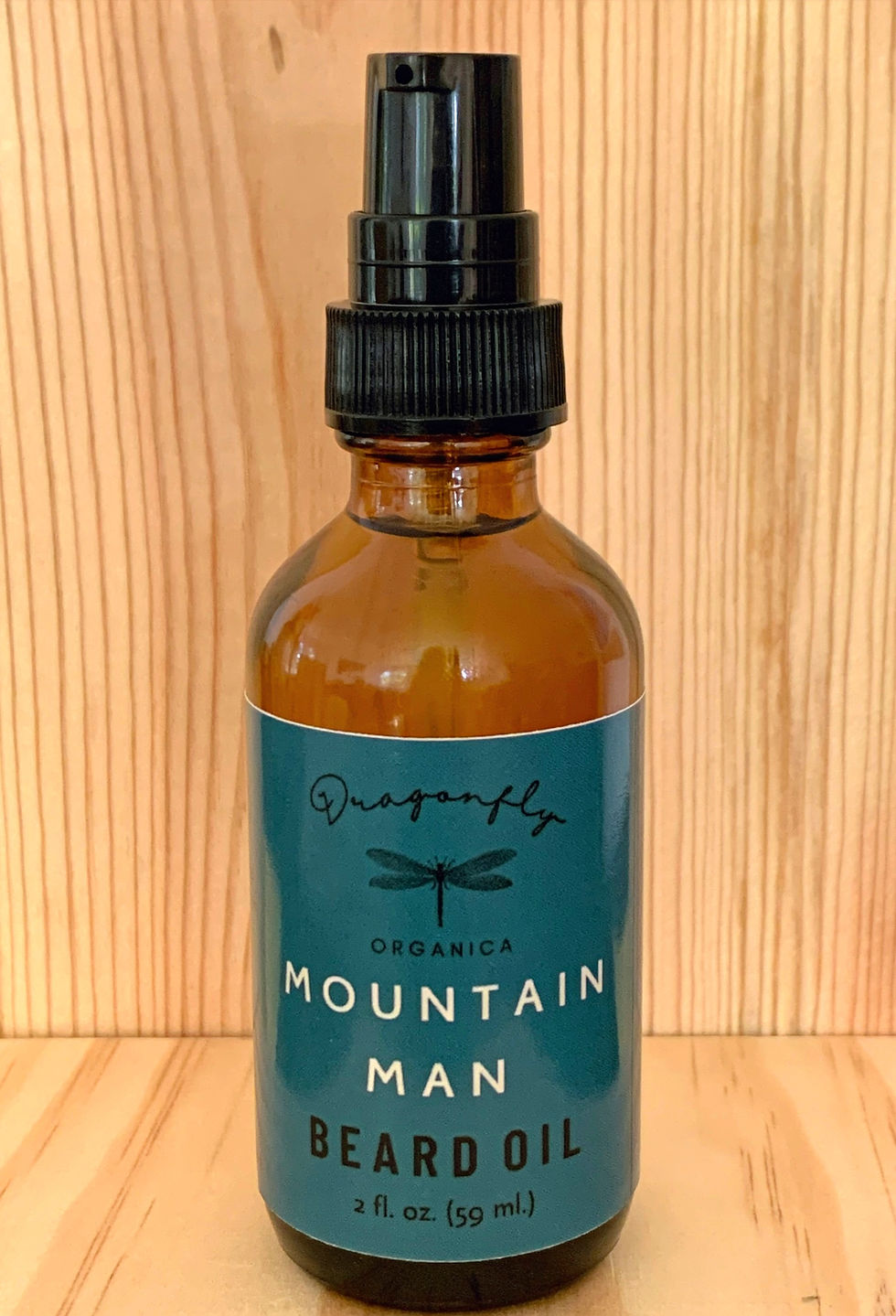 Thumbnail: mountain man beard oil on light wooden stand