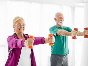 an older couple doing weight training at home