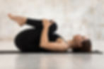 beautiful-woman-practicing-yoga-knees-chest-pose-apanasana-exercise.jpg
