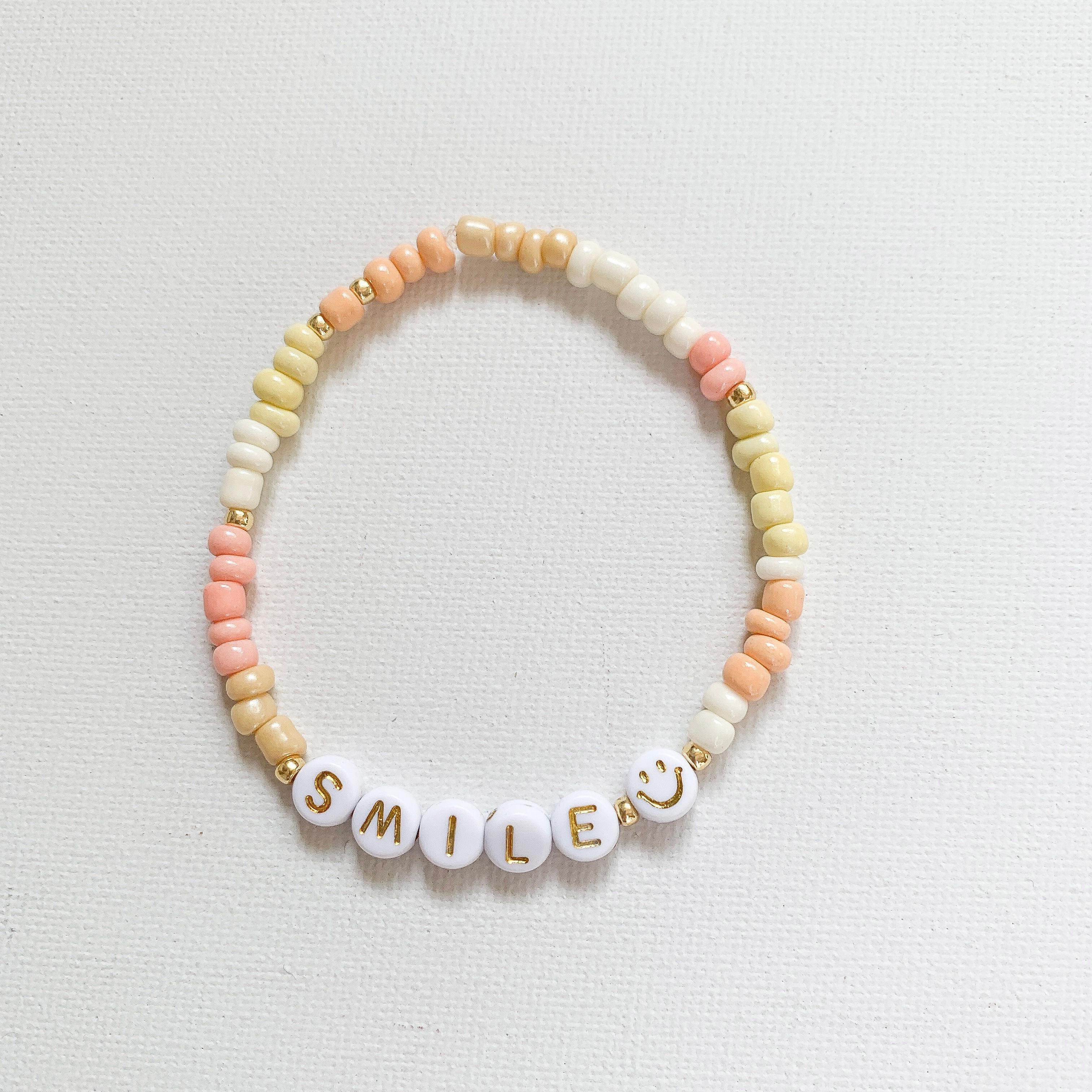 Armband "SMILE", abricot/gelb/crème