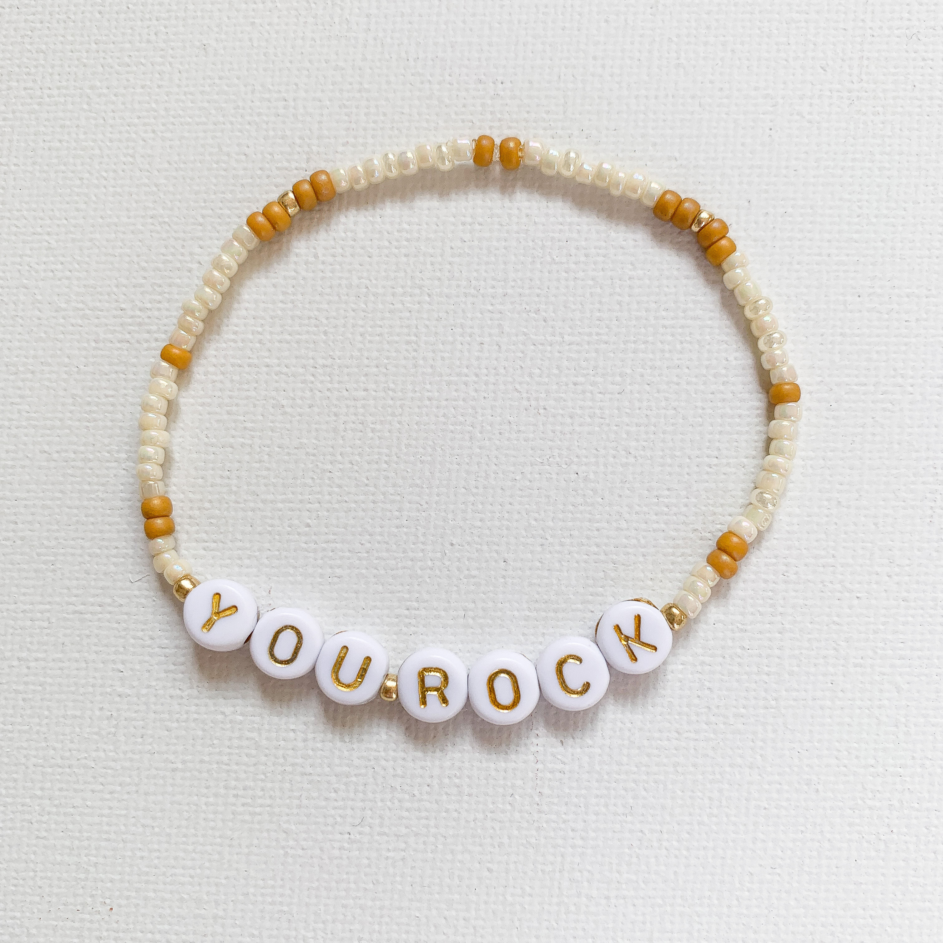 "YOU ROCK", caramel/gold/crème