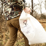 man carrying deer supplement