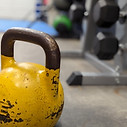 Kettlebell on the gym floor at MBS Fitness in Bridgewater, representing functional fitness, strength, and conditioning exercises.