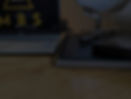 Laptop, notebook, and pen on top of an open book, symbolising learning, planning, and orga