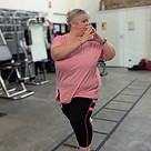 Female client at MBS Fitness doing a lunge to build lower body strength and balance during
