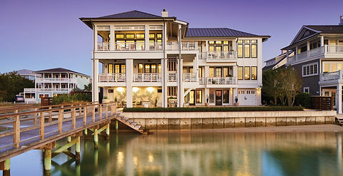 Modern coastal home with three stories and multiple balconies in Wrightsville Beach NC