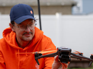 Absolute Imagery Customer fan with one of our UAS drones