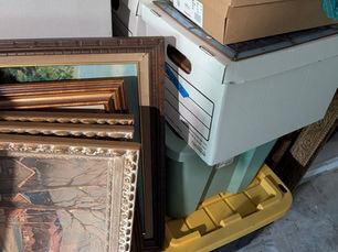 Stack of boxes and framed pictures