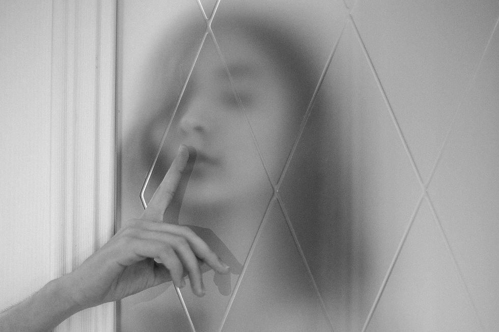 Woman silently holding back a personal secret.