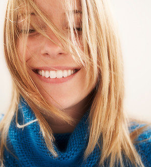 happy blonde woman highlights and lowlights hair salon Great Falls, MT