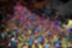 Revellers light up the sky in neon colours for Grenada's Monday Night Mas - Photo cred: Nazini A Benjamin