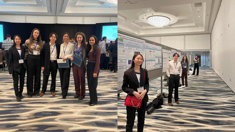 6 people in a group photo smiling and standing at their conference posters