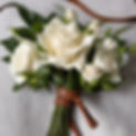 rose, gardenia, tuberose bouquet stems tied in leather cord.jpg