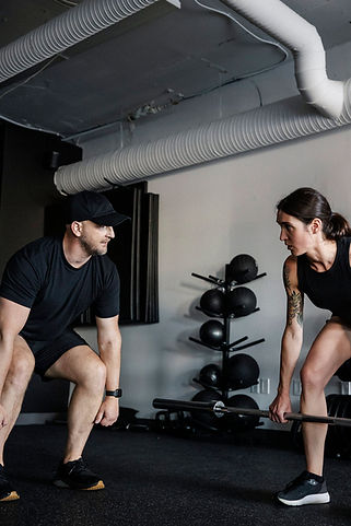 Small group strength training session with coached instruction at VBC Fitness in Victoria BC